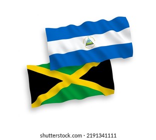 National vector fabric wave flags of Nicaragua and Jamaica isolated on white background. 1 to 2 proportion.