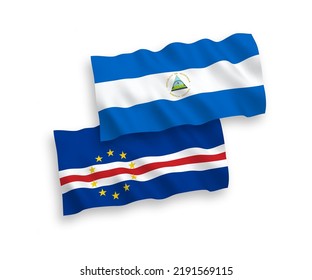 National vector fabric wave flags of Nicaragua and Republic of Cabo Verde isolated on white background. 1 to 2 proportion.