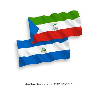 National vector fabric wave flags of Nicaragua and Republic of Equatorial Guinea isolated on white background. 1 to 2 proportion.