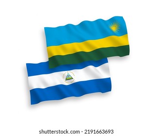National vector fabric wave flags of Nicaragua and Republic of Rwanda isolated on white background. 1 to 2 proportion.