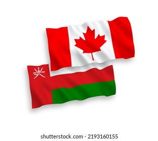 National vector fabric wave flags of Canada and Sultanate of Oman isolated on white background. 1 to 2 proportion.