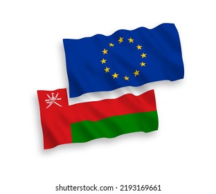 National vector fabric wave flags of European Union and Sultanate of Oman isolated on white background. 1 to 2 proportion.