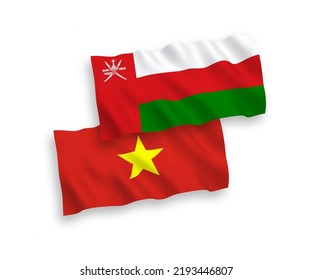 National vector fabric wave flags of Sultanate of Oman and Vietnam isolated on white background. 1 to 2 proportion.