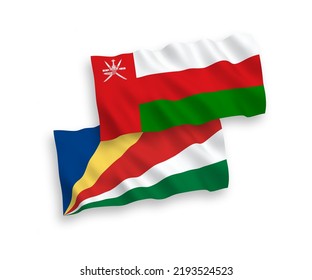 National vector fabric wave flags of Sultanate of Oman and Seychelles isolated on white background. 1 to 2 proportion.