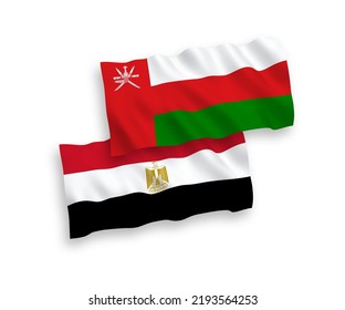 National vector fabric wave flags of Sultanate of Oman and Egypt isolated on white background. 1 to 2 proportion.