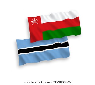 National vector fabric wave flags of Sultanate of Oman and Botswana isolated on white background. 1 to 2 proportion.
