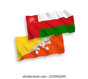National vector fabric wave flags of Sultanate of Oman and Kingdom of Bhutan isolated on white background. 1 to 2 proportion.