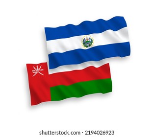 National vector fabric wave flags of Sultanate of Oman and Republic of El Salvador isolated on white background. 1 to 2 proportion.