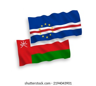 National vector fabric wave flags of Sultanate of Oman and Republic of Cabo Verde isolated on white background. 1 to 2 proportion.