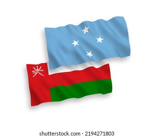 National vector fabric wave flags of Sultanate of Oman and Federated States of Micronesia isolated on white background. 1 to 2 proportion.