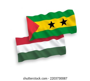 National vector fabric wave flags of Saint Thomas and Prince and Hungary isolated on white background. 1 to 2 proportion.