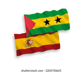 National vector fabric wave flags of Saint Thomas and Prince and Spain isolated on white background. 1 to 2 proportion.