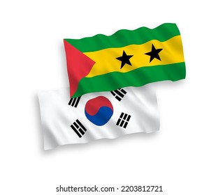 National vector fabric wave flags of South Korea and Saint Thomas and Prince isolated on white background. 1 to 2 proportion.