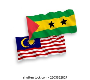 National vector fabric wave flags of Saint Thomas and Prince and Malaysia isolated on white background. 1 to 2 proportion.