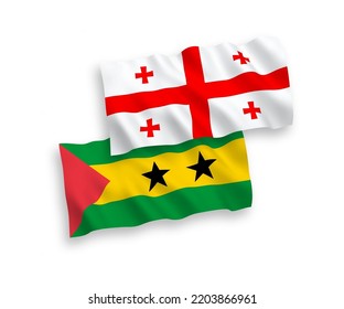 National vector fabric wave flags of Saint Thomas and Prince and Georgia isolated on white background. 1 to 2 proportion.