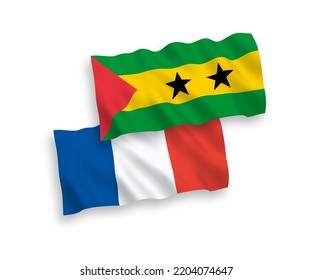 National vector fabric wave flags of France and Saint Thomas and Prince isolated on white background. 1 to 2 proportion.