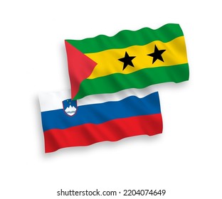 National vector fabric wave flags of Slovenia and Saint Thomas and Prince isolated on white background. 1 to 2 proportion.