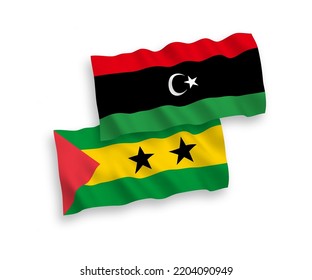 National vector fabric wave flags of Saint Thomas and Prince and Libya isolated on white background. 1 to 2 proportion.