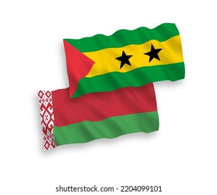 National vector fabric wave flags of Saint Thomas and Prince and Belarus isolated on white background. 1 to 2 proportion.