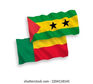 National vector fabric wave flags of Saint Thomas and Prince and Benin isolated on white background. 1 to 2 proportion.