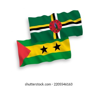 National vector fabric wave flags of Saint Thomas and Prince and Dominica isolated on white background. 1 to 2 proportion.