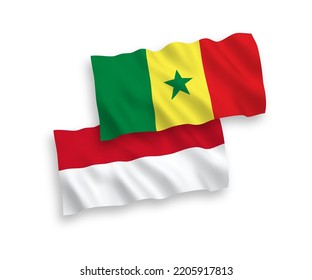 Nationale Vektor-Wellen-Flaggen Indonesiens und der Republik Senegal einzeln auf weißem Hintergrund. 1 bis 2 %.