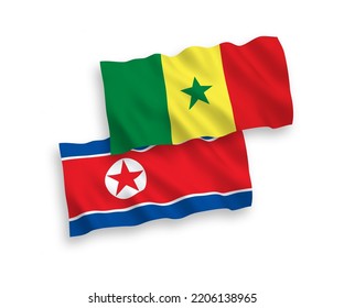 Nationale Vektor-Wellen-Flaggen von Nordkorea und der Republik Senegal einzeln auf weißem Hintergrund. 1 bis 2 %.