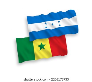 National vector fabric wave flags of Republic of Senegal and Honduras isolated on white background. 1 to 2 proportion.
