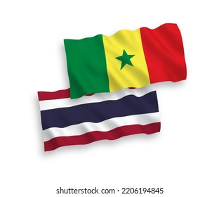 Banderas de olas de tela vectorial nacional de la República del Senegal y Tailandia aisladas en fondo blanco. de 1 a 2.