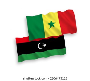National vector fabric wave flags of Republic of Senegal and Libya isolated on white background. 1 to 2 proportion.
