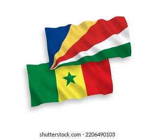 National vector fabric wave flags of Republic of Senegal and Seychelles isolated on white background. 1 to 2 proportion.