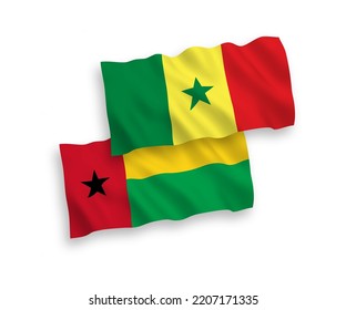 National vector fabric wave flags of Republic of Senegal and Republic of Guinea Bissau isolated on white background. 1 to 2 proportion.
