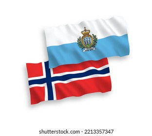 National vector fabric wave flags of Norway and San Marino isolated on white background. 1 to 2 proportion.