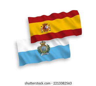 National vector fabric wave flags of San Marino and Spain isolated on white background. 1 to 2 proportion.