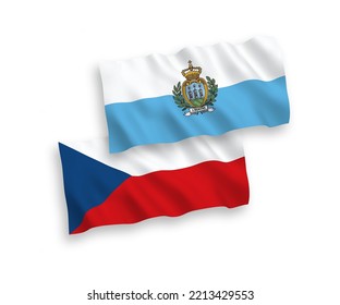 National vector fabric wave flags of Czech Republic and San Marino isolated on white background. 1 to 2 proportion.