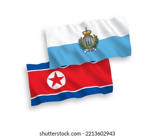 National vector fabric wave flags of North Korea and San Marino isolated on white background. 1 to 2 proportion.
