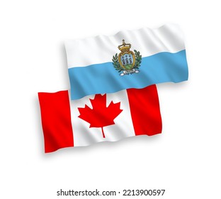 National vector fabric wave flags of Canada and San Marino isolated on white background. 1 to 2 proportion.