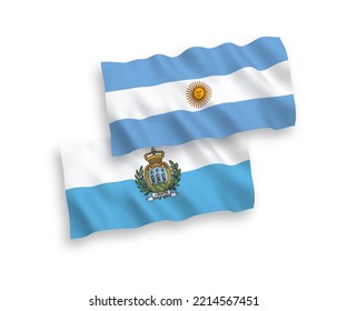 National vector fabric wave flags of San Marino and Argentina isolated on white background. 1 to 2 proportion.