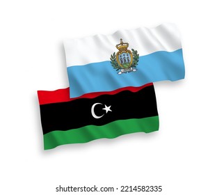 Banderas de olas de tela vectorial nacional de San Marino y Libia aisladas en fondo blanco. de 1 a 2.