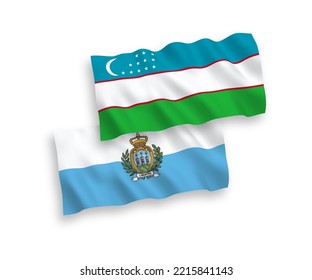 National vector fabric wave flags of San Marino and Uzbekistan isolated on white background. 1 to 2 proportion.