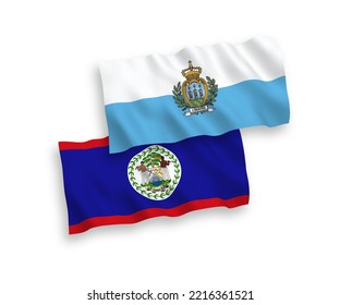 National vector fabric wave flags of San Marino and Belize isolated on white background. 1 to 2 proportion.