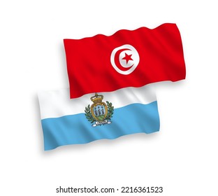 Banderas de olas de tela vectorial nacional de San Marino y la República de Túnez aisladas en fondo blanco. de 1 a 2.