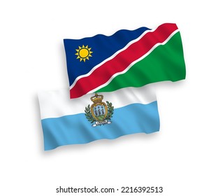 National vector fabric wave flags of San Marino and Republic of Namibia isolated on white background. 1 to 2 proportion.