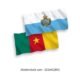 National vector fabric wave flags of San Marino and Cameroon isolated on white background. 1 to 2 proportion.