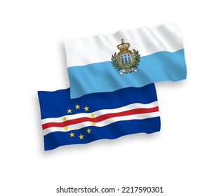 National vector fabric wave flags of San Marino and Republic of Cabo Verde isolated on white background. 1 to 2 proportion.