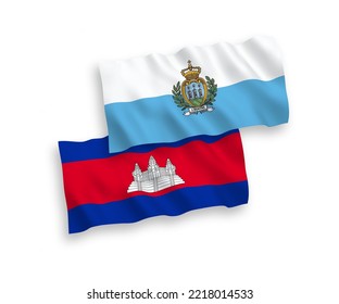 National vector fabric wave flags of San Marino and Kingdom of Cambodia isolated on white background. 1 to 2 proportion.