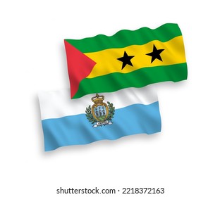 National vector fabric wave flags of San Marino and Saint Thomas and Prince isolated on white background. 1 to 2 proportion.