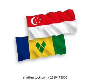 National vector fabric wave flags of Saint Vincent and the Grenadines and Singapore isolated on white background. 1 to 2 proportion.