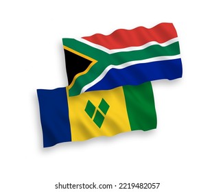 National vector fabric wave flags of Saint Vincent and the Grenadines and Republic of South Africa isolated on white background. 1 to 2 proportion.