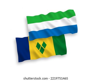 National vector fabric wave flags of Saint Vincent and the Grenadines and Sierra Leone isolated on white background. 1 to 2 proportion.